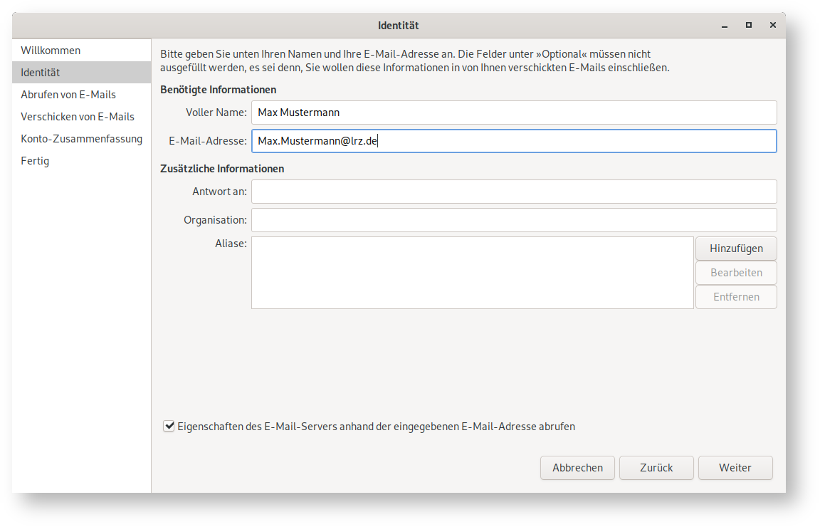 Fenster Identität. Linke Spalte mit 6 Punkten, ausgewählt Punkt 2, Identität. Rechts das Hauptfeld. Bitte geben Sie unten Ihren Namen und Ihre E-Mail-Adresse an. Die Felder unter 'Optional' müssen nicht ausgefüllt werden, es sei denn, Sie wollen diese Informationen in von Ihnen verschhickten E-Mails einschließen. Benötigte Informationen. Voller Name, Eingabefeld Max Mustermann. E-Mail-Adresse, Eingabefeld Max.Mustermann At lrz.de. Zusätzliche Informationen (oben mit 'Optional' bezeichnet). Antwort an, leeres Eingabefeld. Organisation, leeres Eingabefeld. Aliase, größeres leeres Eingabefeld, rechts davon untereinander 3 Schaltflächen, Hinzufügen, 2 mal abgeblendet Bearbeiten, Entfernen. Ziemlich weit unten, Kästchen mit Haken, Eigenschaften des E-Mail-Servers anhand der eingegebenen E-Mail-Adresse abrufen. Ganz unten rechts, 3 Schaltflächen Abbrechen, Zurück, Weiter.